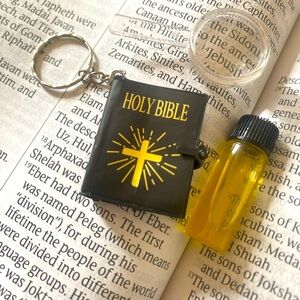 Mini bible keychain with magnifying glass and anointing oil..